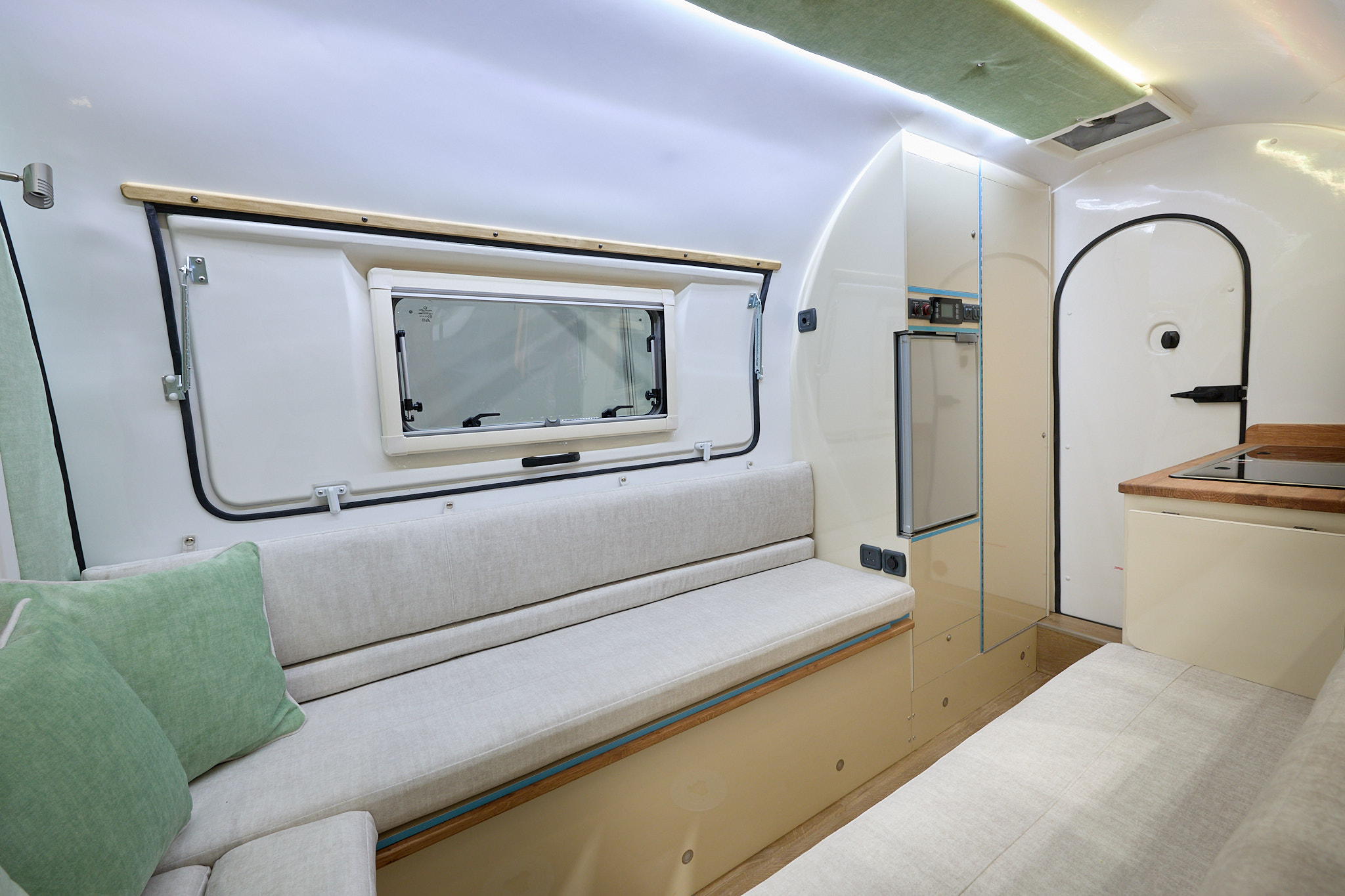 Leisure Pods Ltd Campod O2 interior, white upholstery, lounge and kitchen