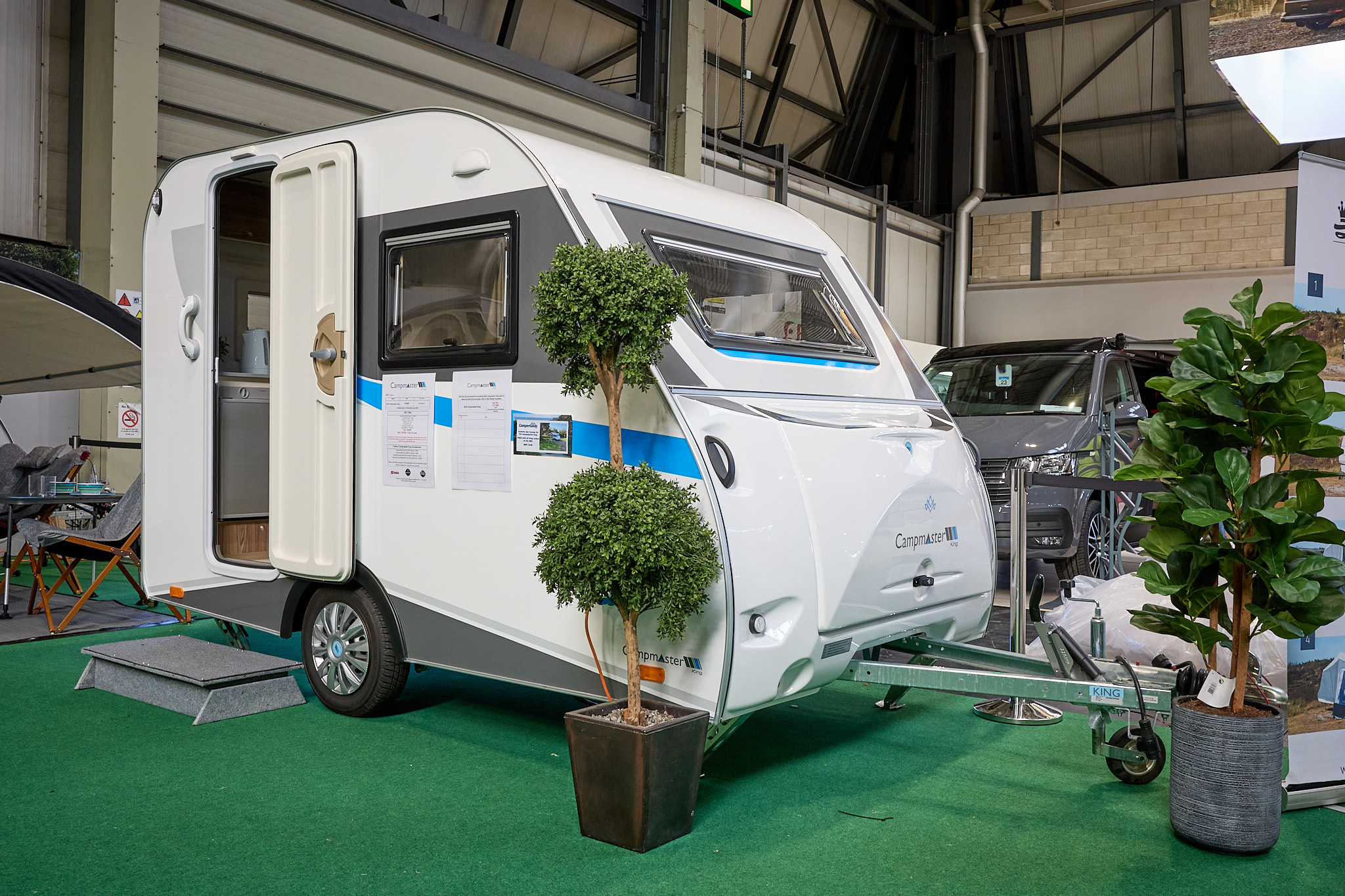 Campmaster King exterior, white caravan with grey/blue decals, single axle