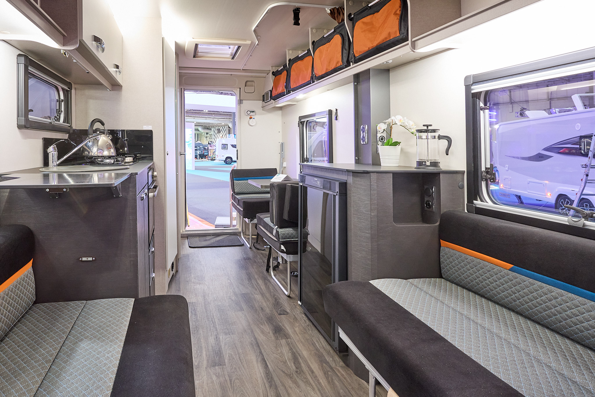 Swift Basecamp 4 interior, black/grey upholstery, wooden floor, lounge, kitchen, rear dinette, skylight