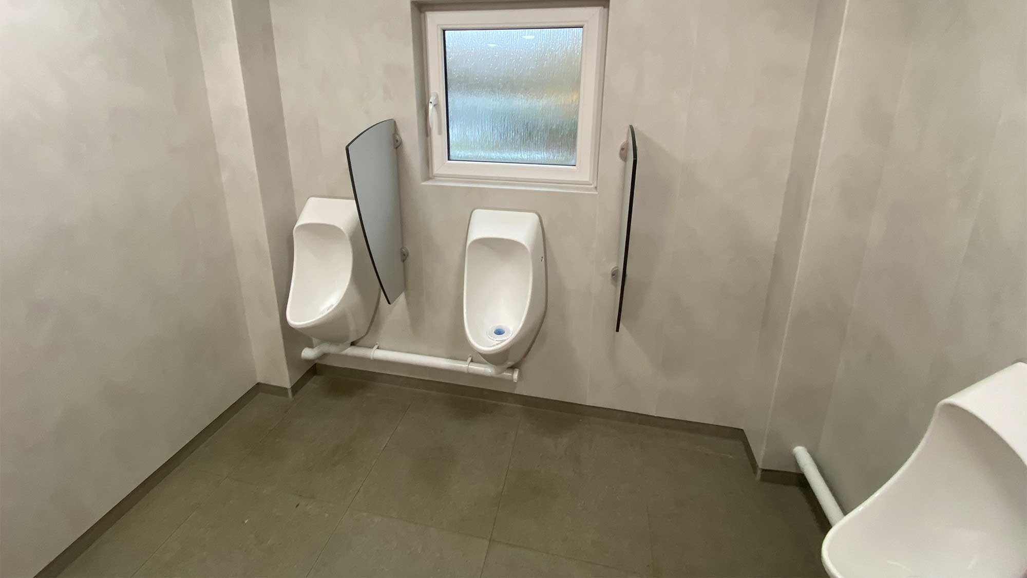 Two waterless urinals in the facilities block at Abbey Wood Club Campsite