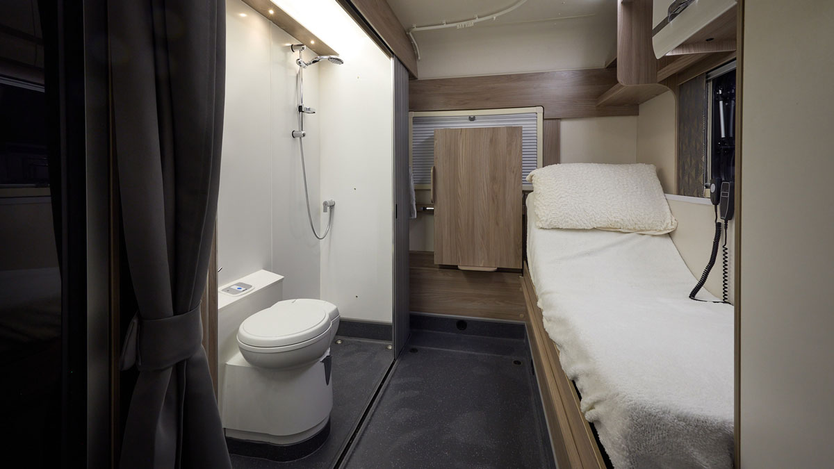 Electric adjustable bed and wet room in a Swift Escape 674 adapted by Coachbuilt GB