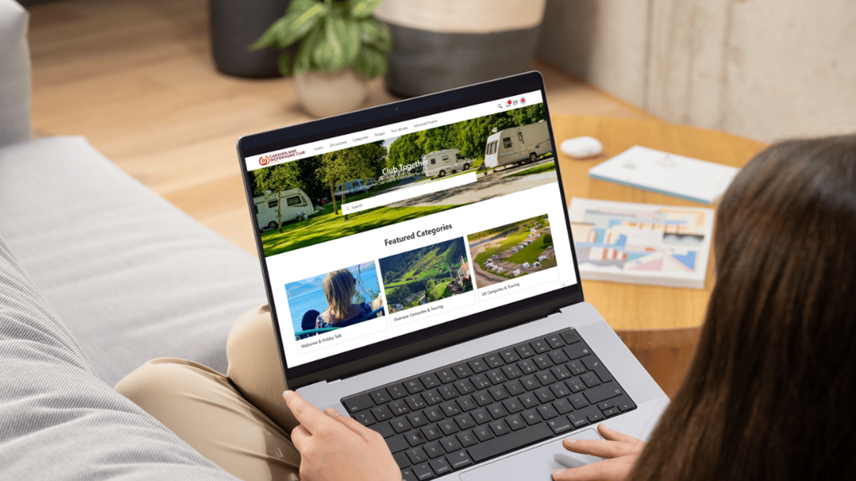 A laptop displaying the new forum platform for Club Together.