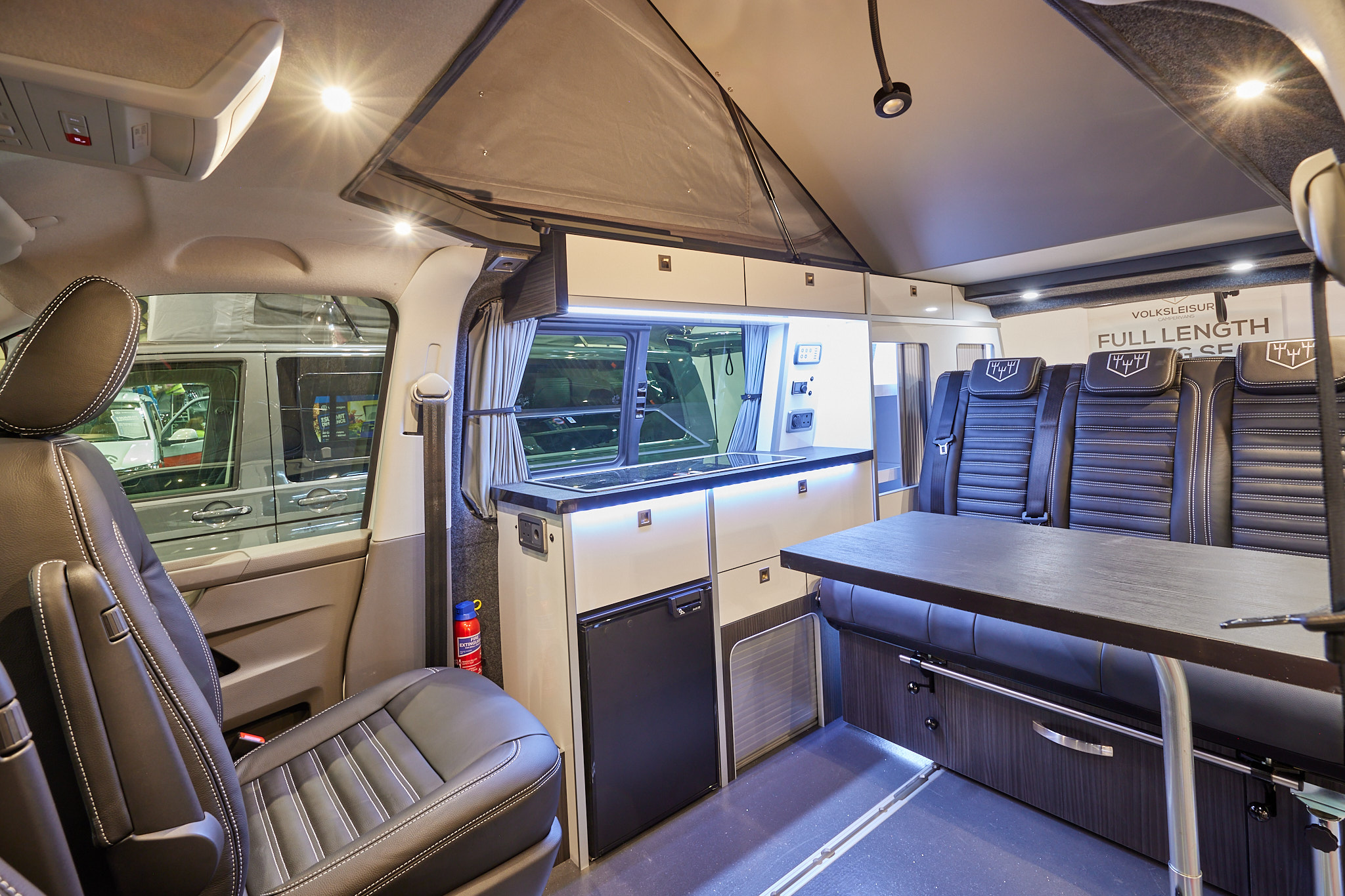 Volksleisure White Star has black upholstery; the panelling is cream.  The rear passenger seat unit can be easily move forwards and backwards due to the sliding rail.