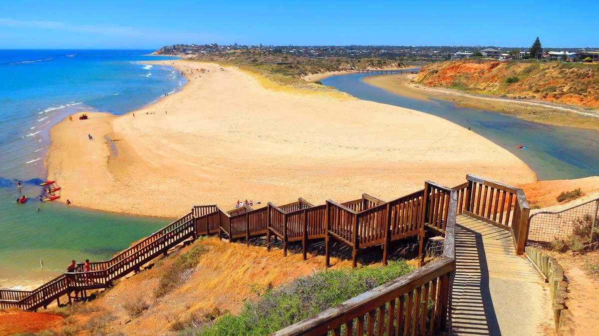 A view from the top of the wooden steps leading down to Adelaide beach. Golden sand and blue sea