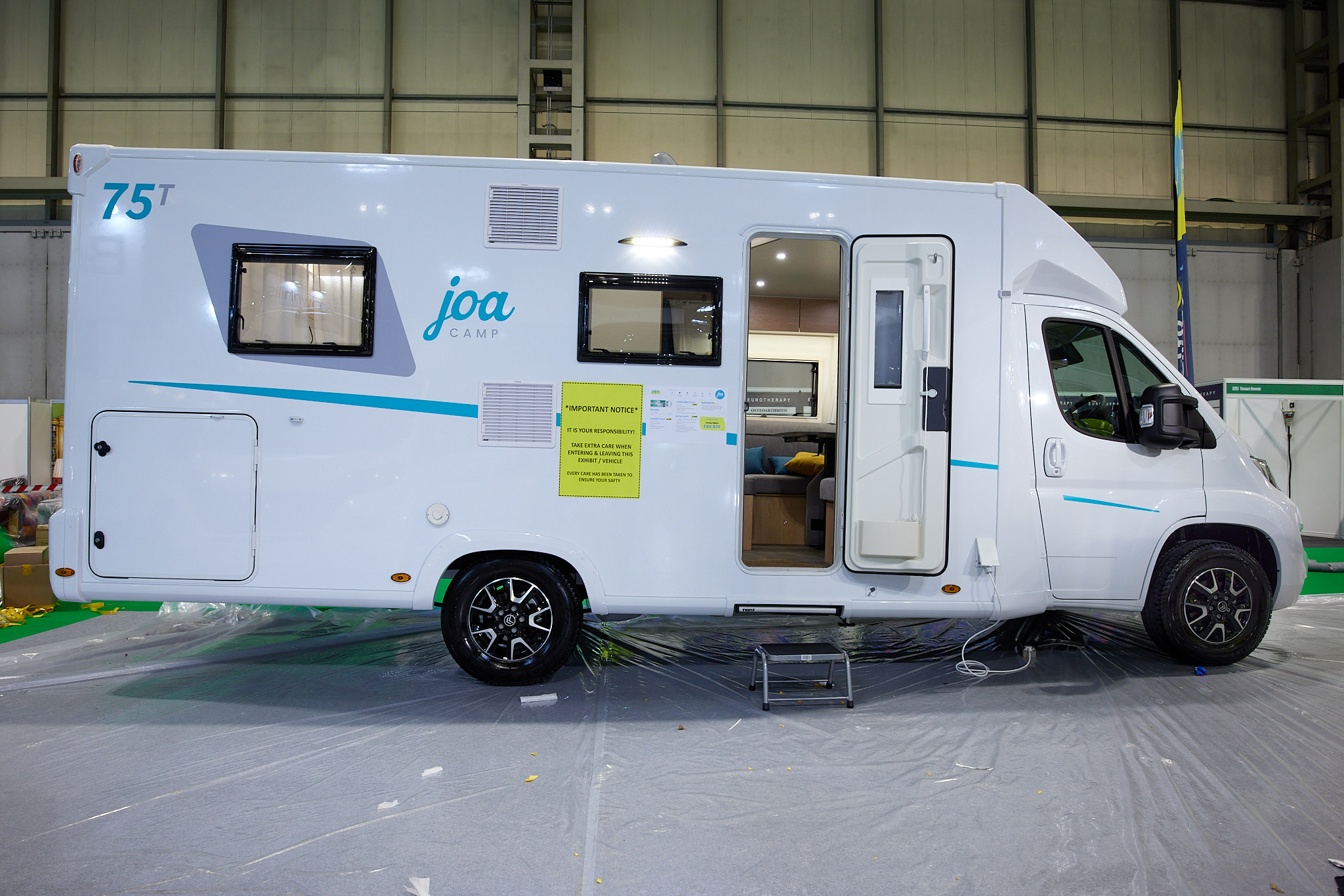 Coachbuilt, white, turquoise graphics