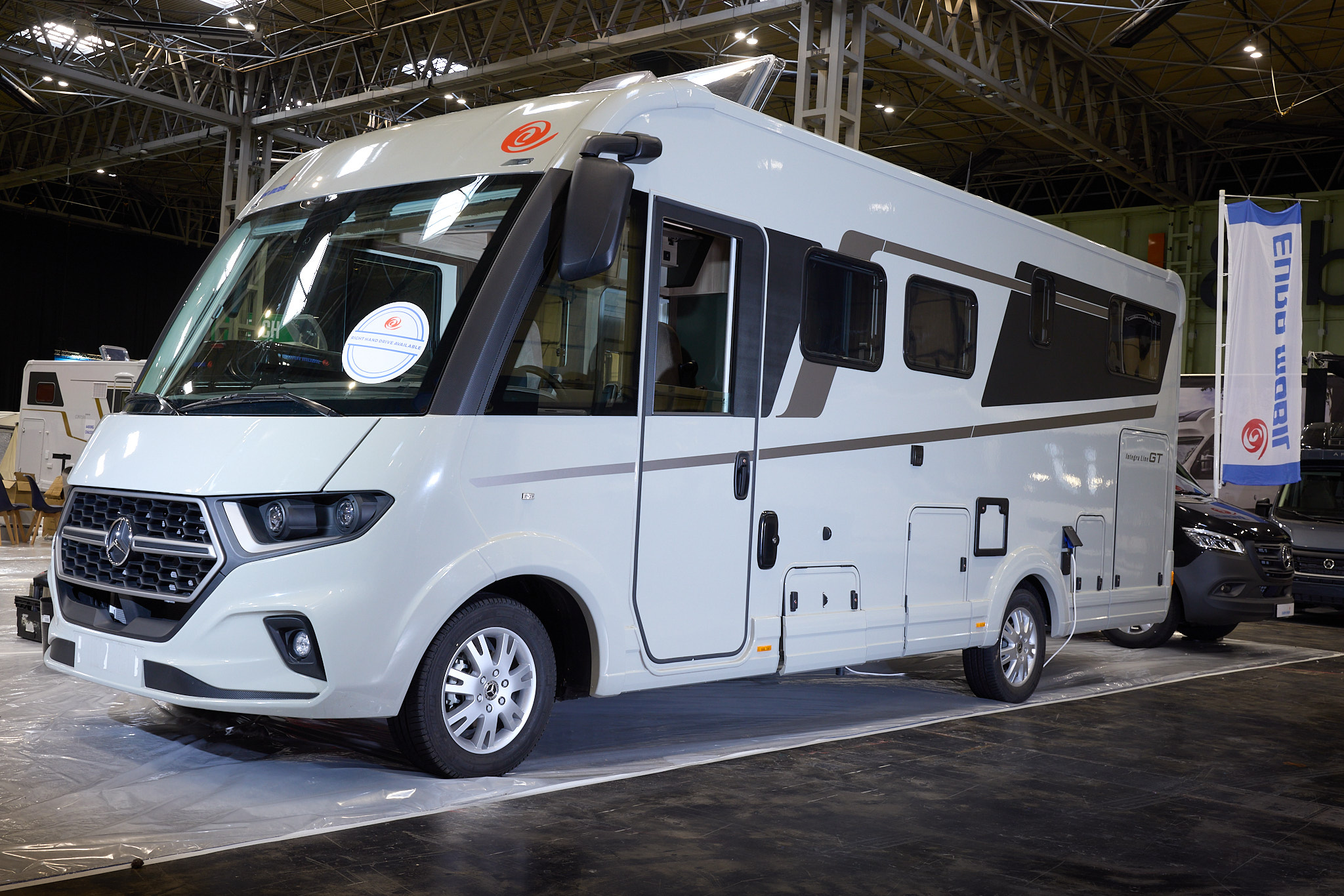 The Eura Mobil Integra Line GT 726 EF is white with bronze decals.  The skylight is open.