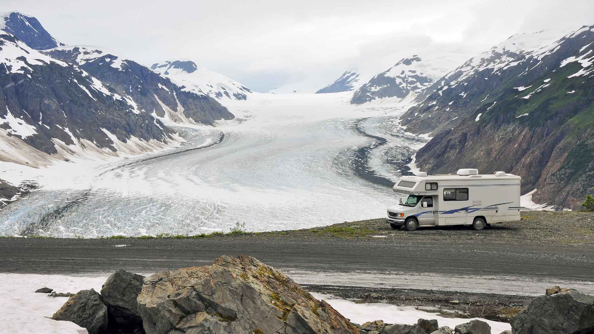 Motorhome by a snowy mountain