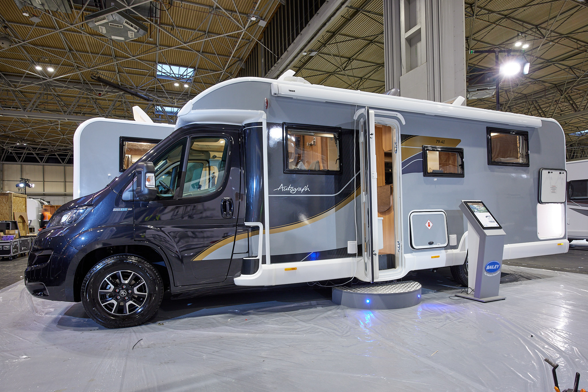 Coachbuilt, dark blue cab, grey body