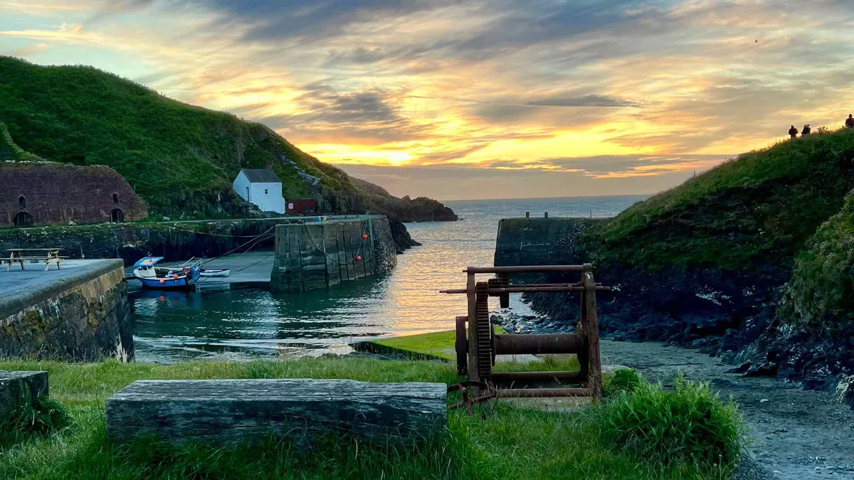 sunset over Portgain Harbour in Wales, near St Davids Lleithyr Meadow Club Campsite. Member photo by Lisa Taverner