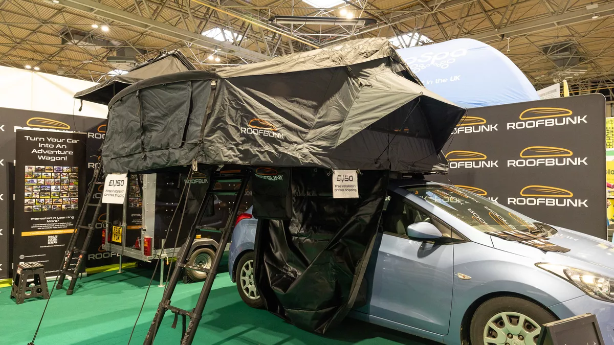 The RoofBunk Explorer has green canvas, it has a green ladder in order to gain easy access.