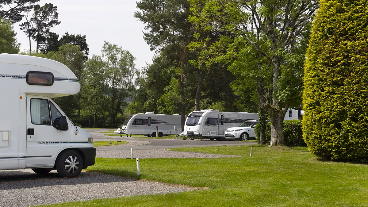 Hardstanding with awning pitches at Stover Club Campsite.