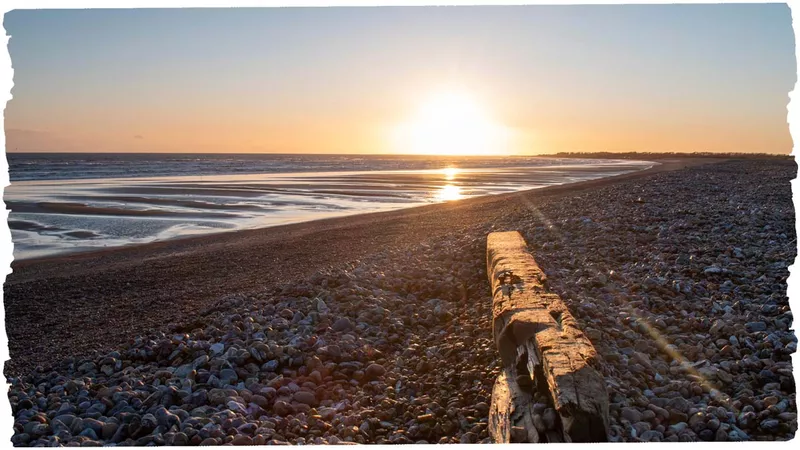Sunset at pebbled beach
