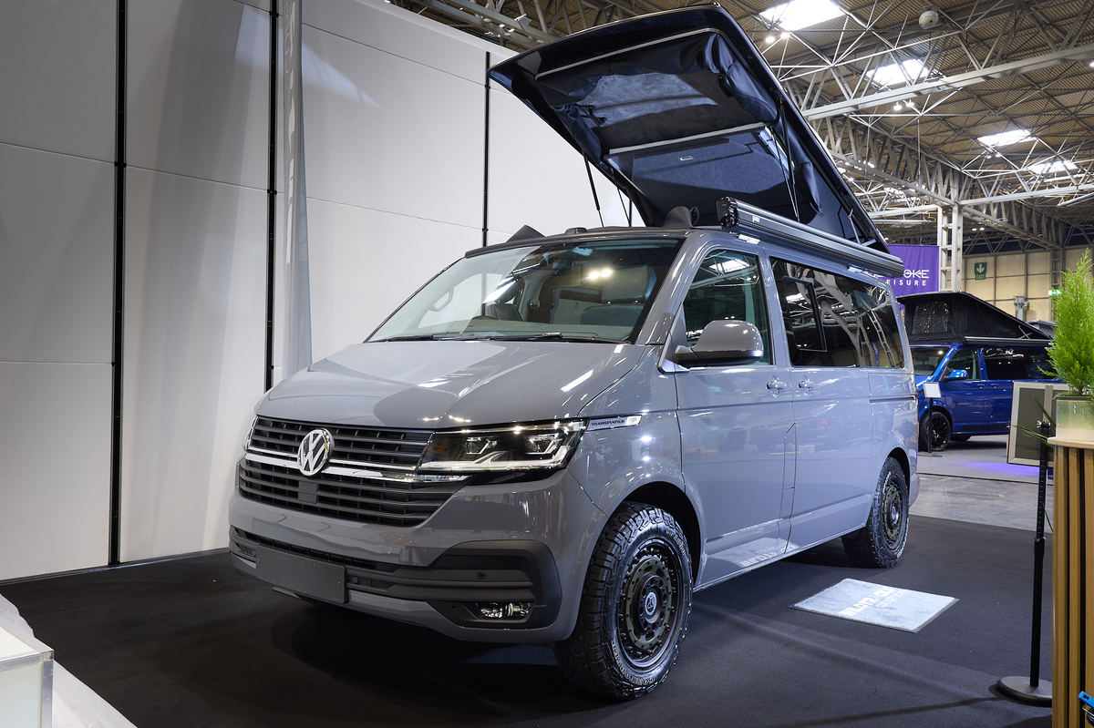 Wildtracks Campervans Explorer is grey and its rising roof is fully extended.