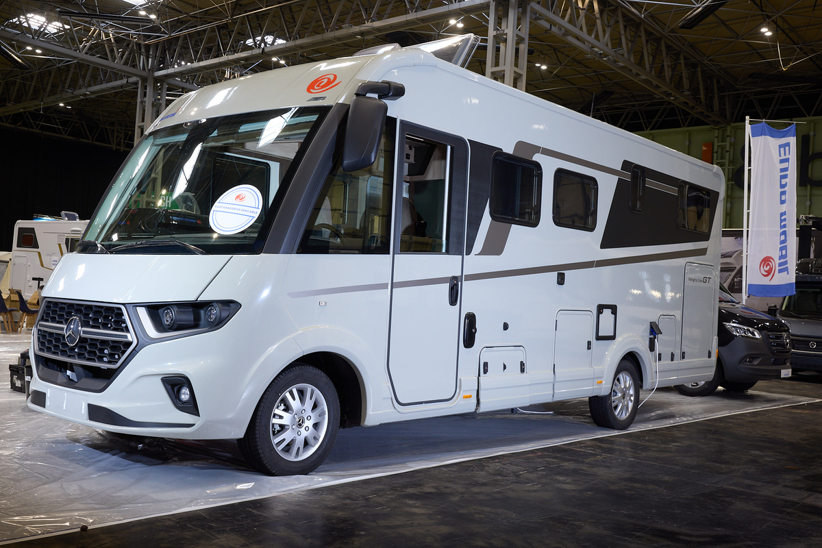 The Eura Mobil Integra Line GT 726 EF is white with bronze decals.  The skylight is open.