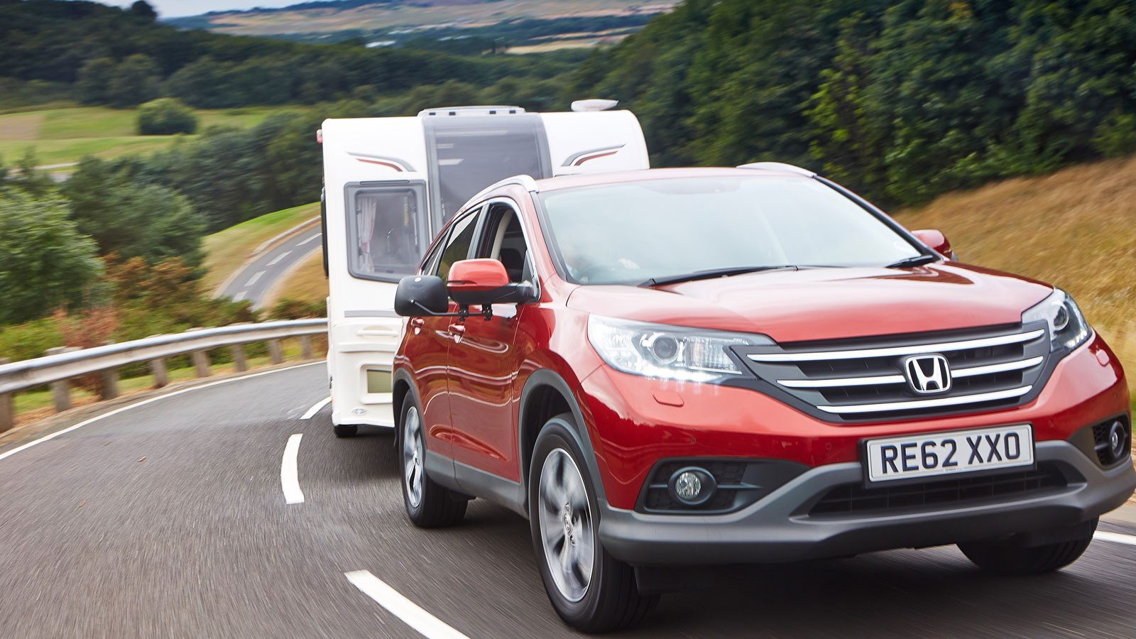 4x4 towcar pulling a caravan up a hill